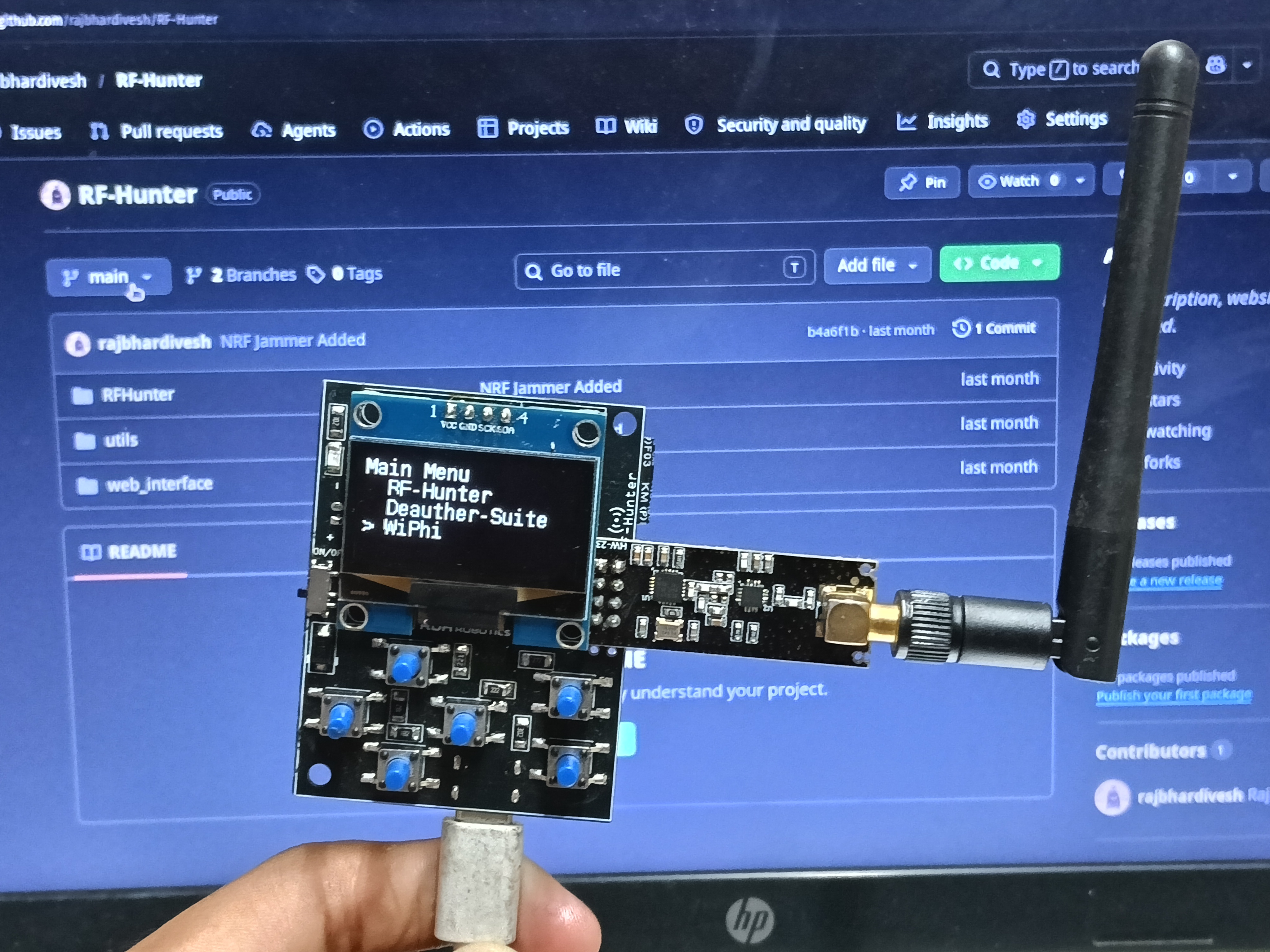 RF-Hunter device showing the main RF-Hunter menu on its OLED display